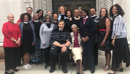 Black clergy women gather the night prior to Bishop Carlye Hughes’ (seated on left) consecration in 2018